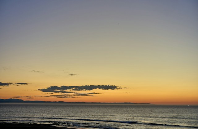 A soft golden sunset over the ocean