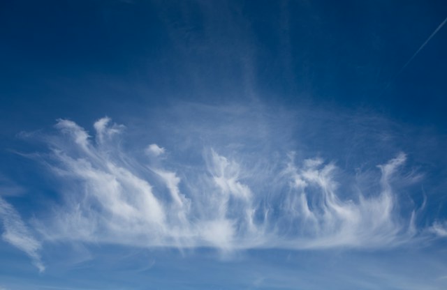 Soft clouds in a pale blue sky